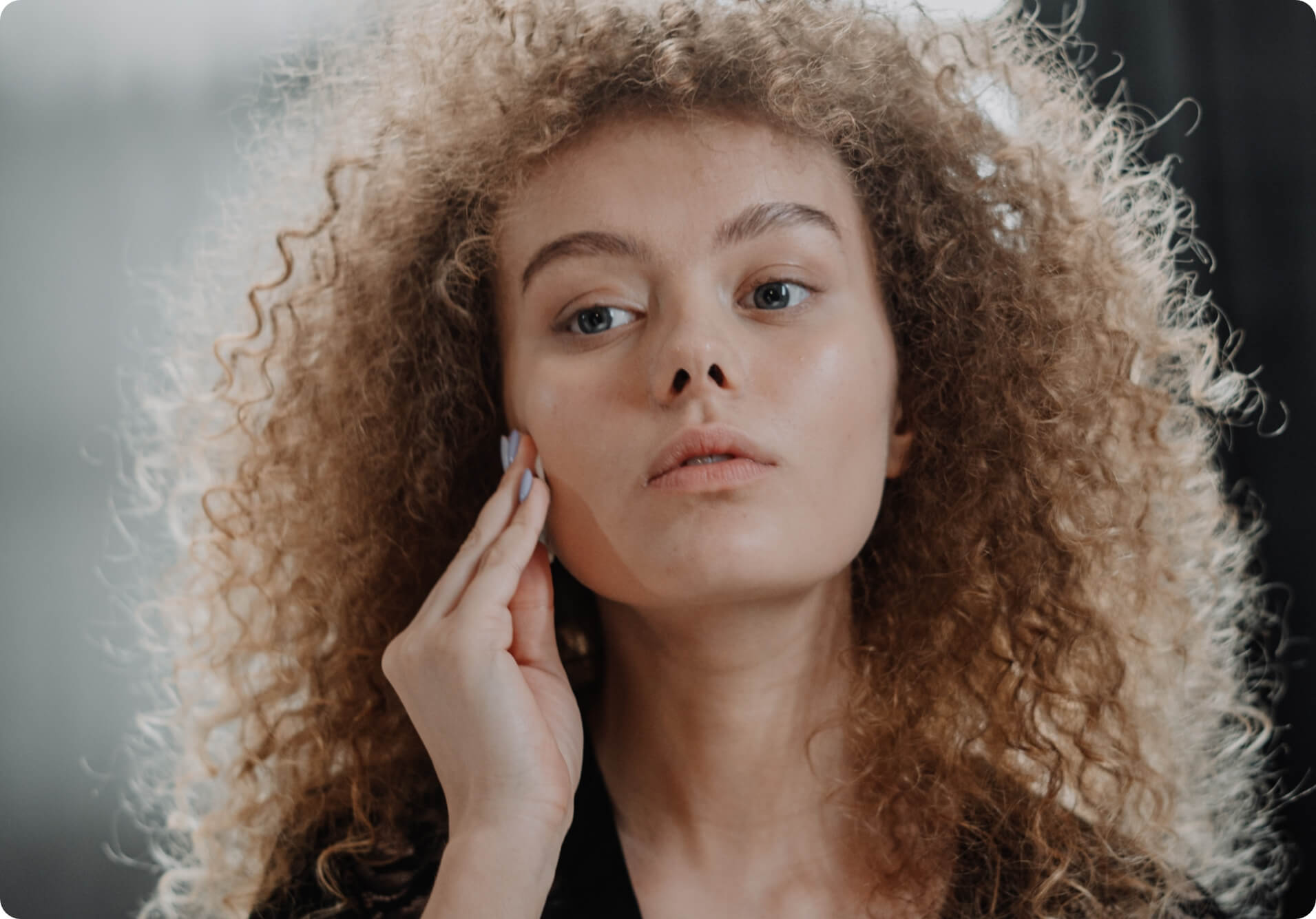 woman demonstrating using Cellre Renew Cleanser to remove makeup, exfoliate and cleanse skin gently for stressed and sensitive skin