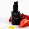 Retreat Facial Oil with product texture drops and strawberries