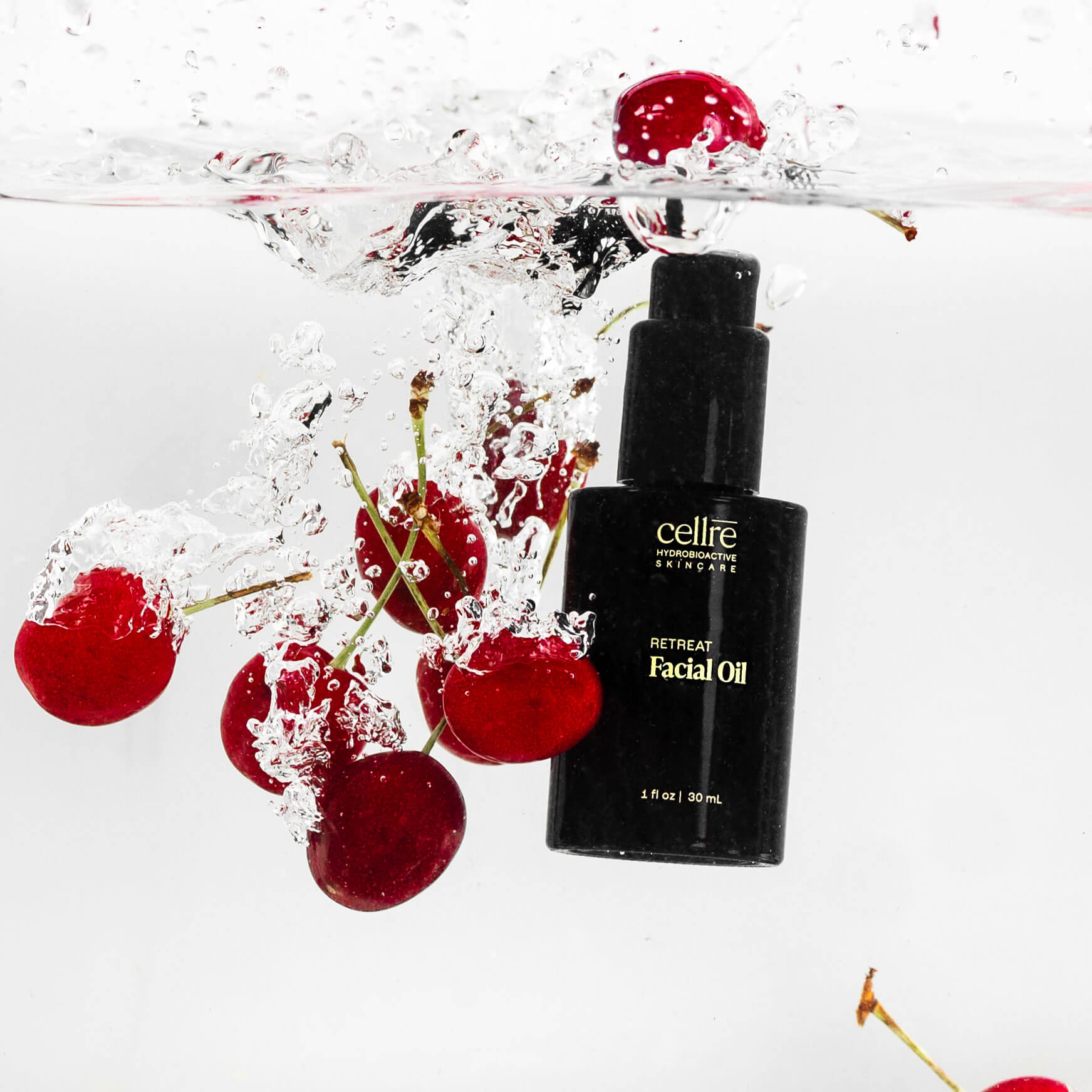 Retreat Facial Oil dropping in water with cherries